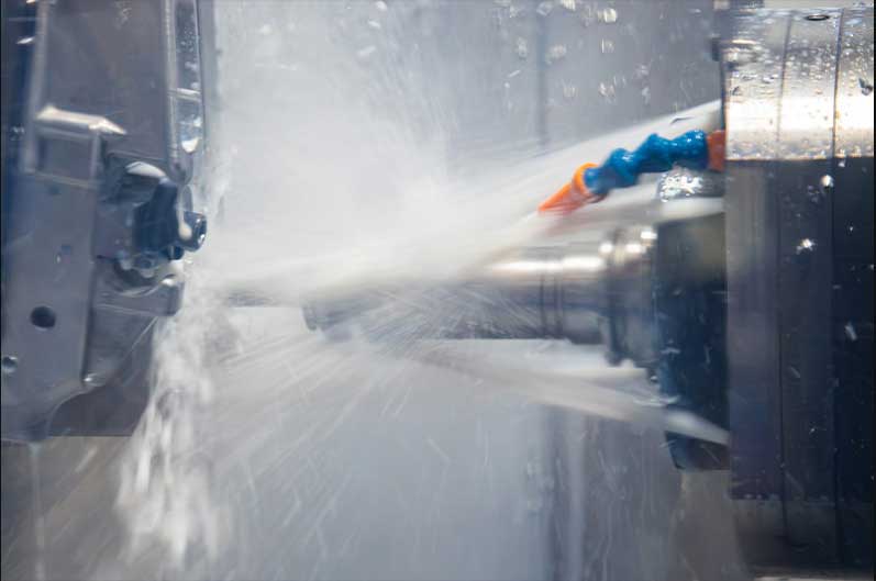 CNC machining with coolant spray